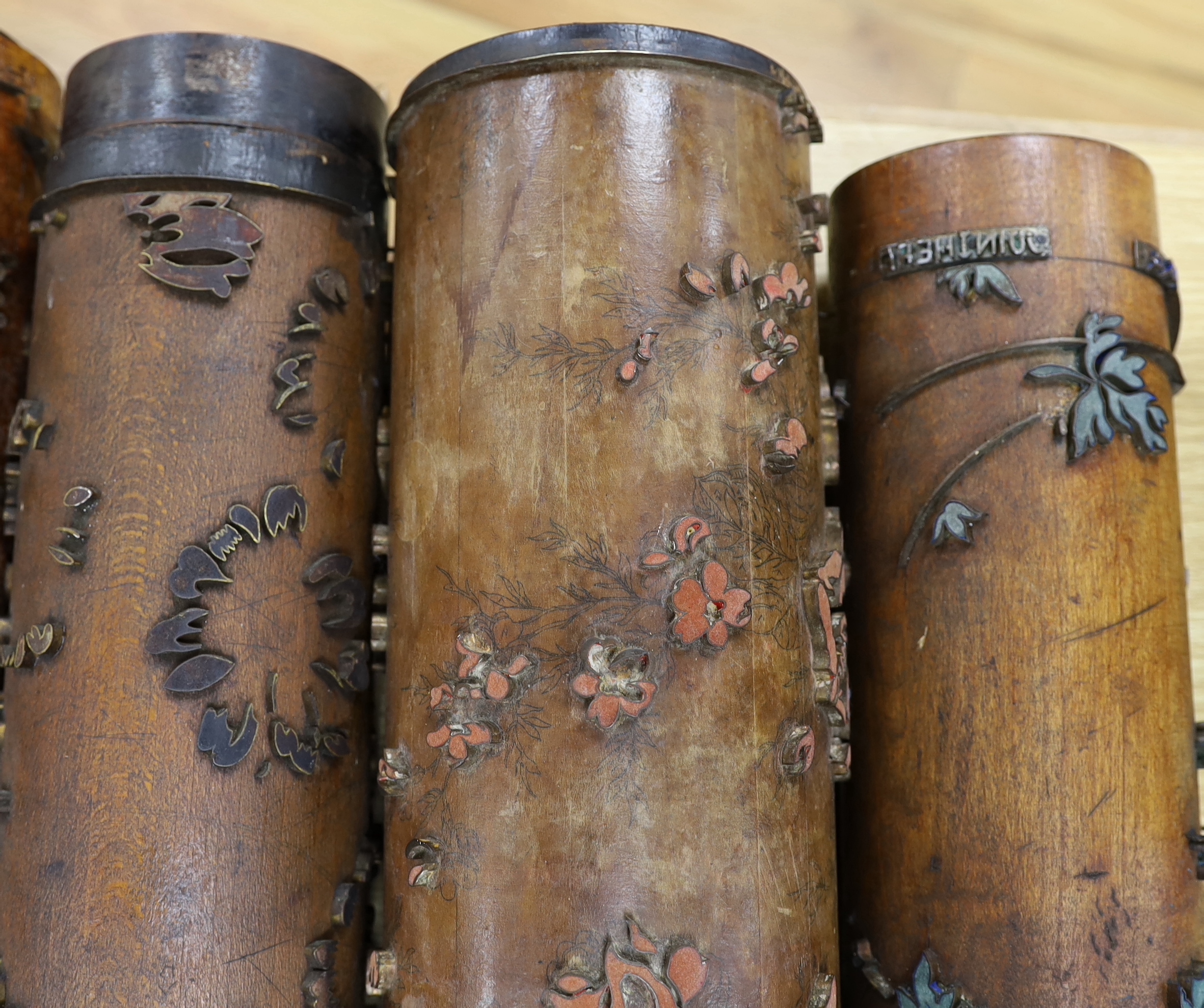 Five USA wooden print rollers for wallpaper, late 19th century, including a UWPC (United Wall Paper Craftsmen of North America) example, another stamped with serial numbers, longest 60.5cm